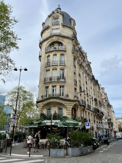 a tall building with many balconies on the top of it