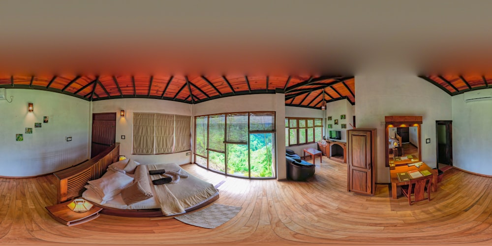 a fish - eye view of a living room with wood floors