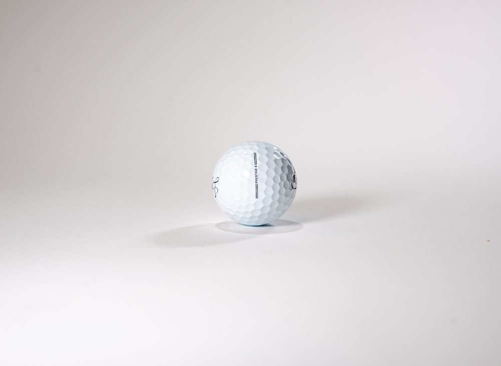 a golf ball sitting on top of a white table
