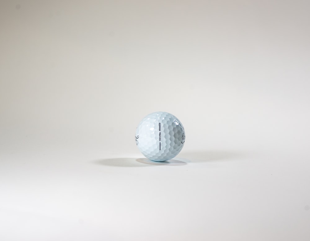 a golf ball sitting on top of a white table
