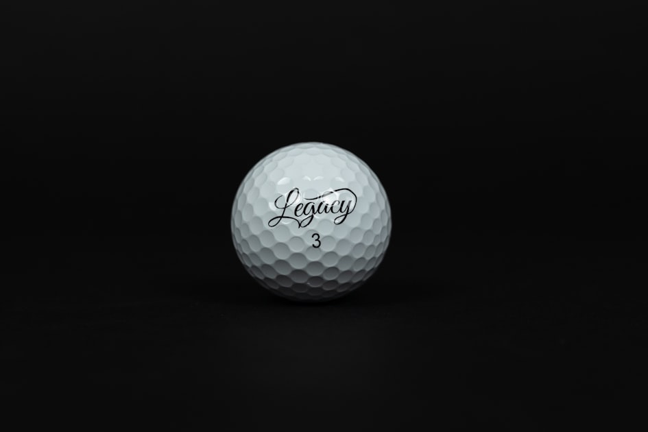 a white golf ball on a black background