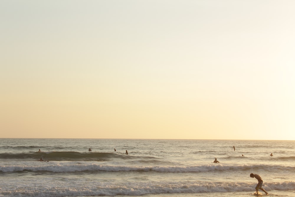 a person riding a surfboard on a wave in the ocean