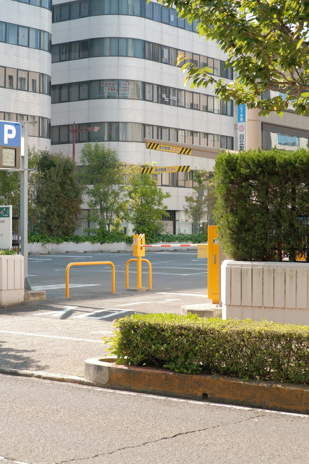 an empty parking lot in front of a large building