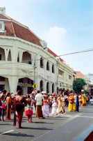 Photo of a colorful street festival in Santa Bárbara with locals dancing and celebrating.