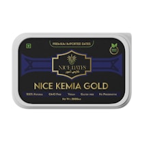 A rectangular packaging for 'NICE KEMIA GOLD' dates, featuring a black and gold design with text indicating it is premium imported, 100% natural, GMO-free, vegan, gluten-free, and contains no preservatives. The net weight is 500 grams.