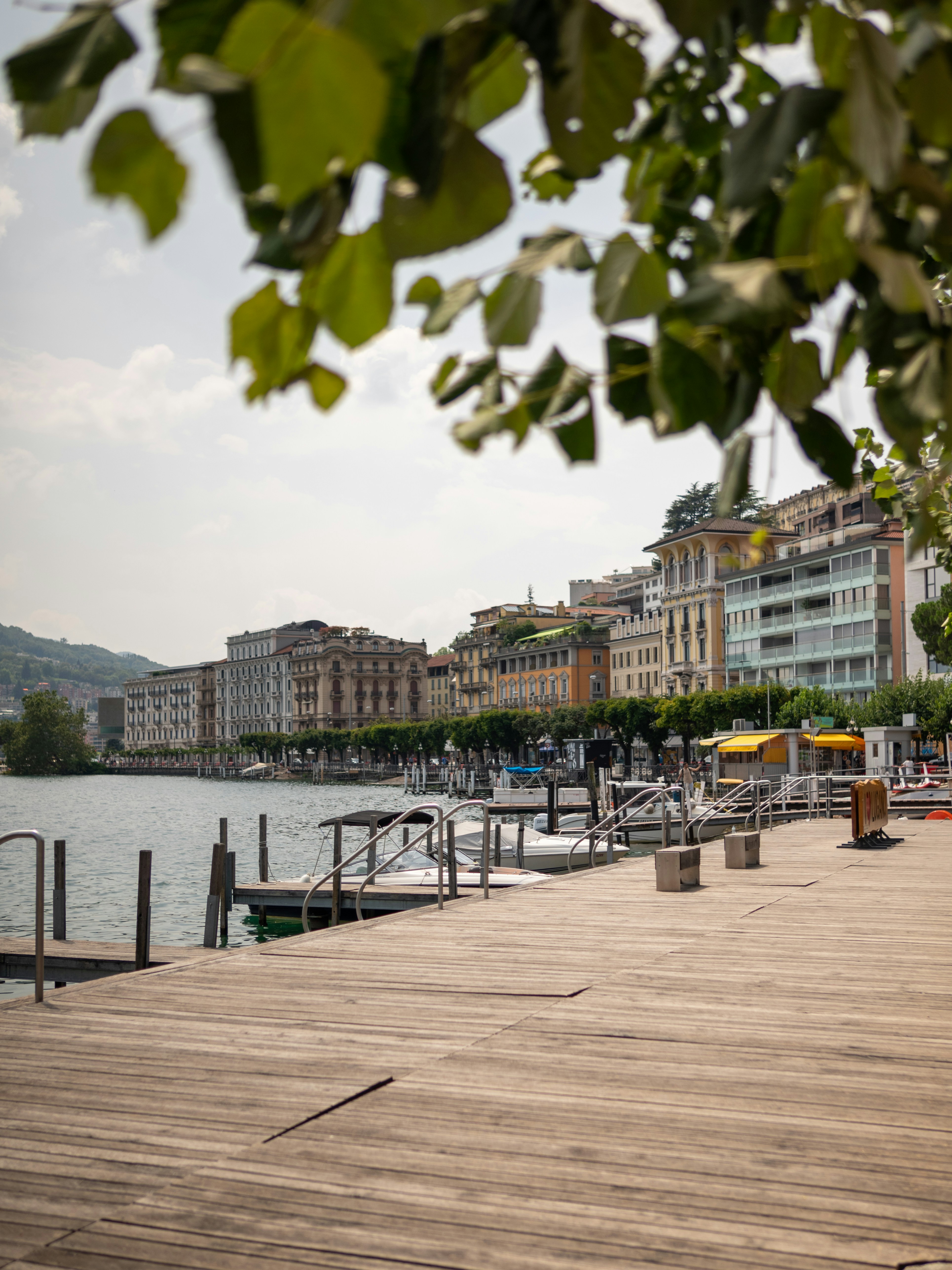 a wooden dock with a few boats on it