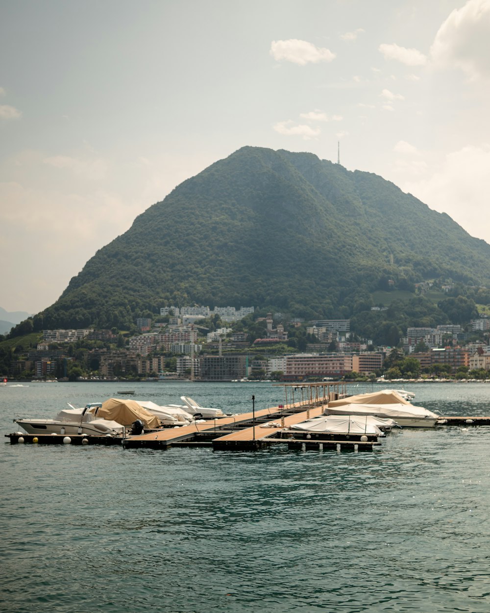 a large body of water with a mountain in the background