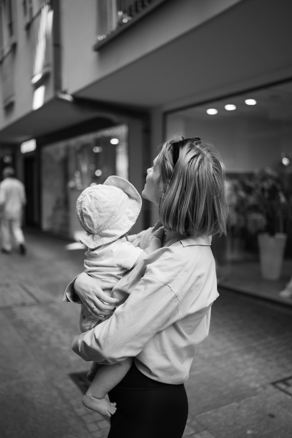 a woman holding a child in her arms