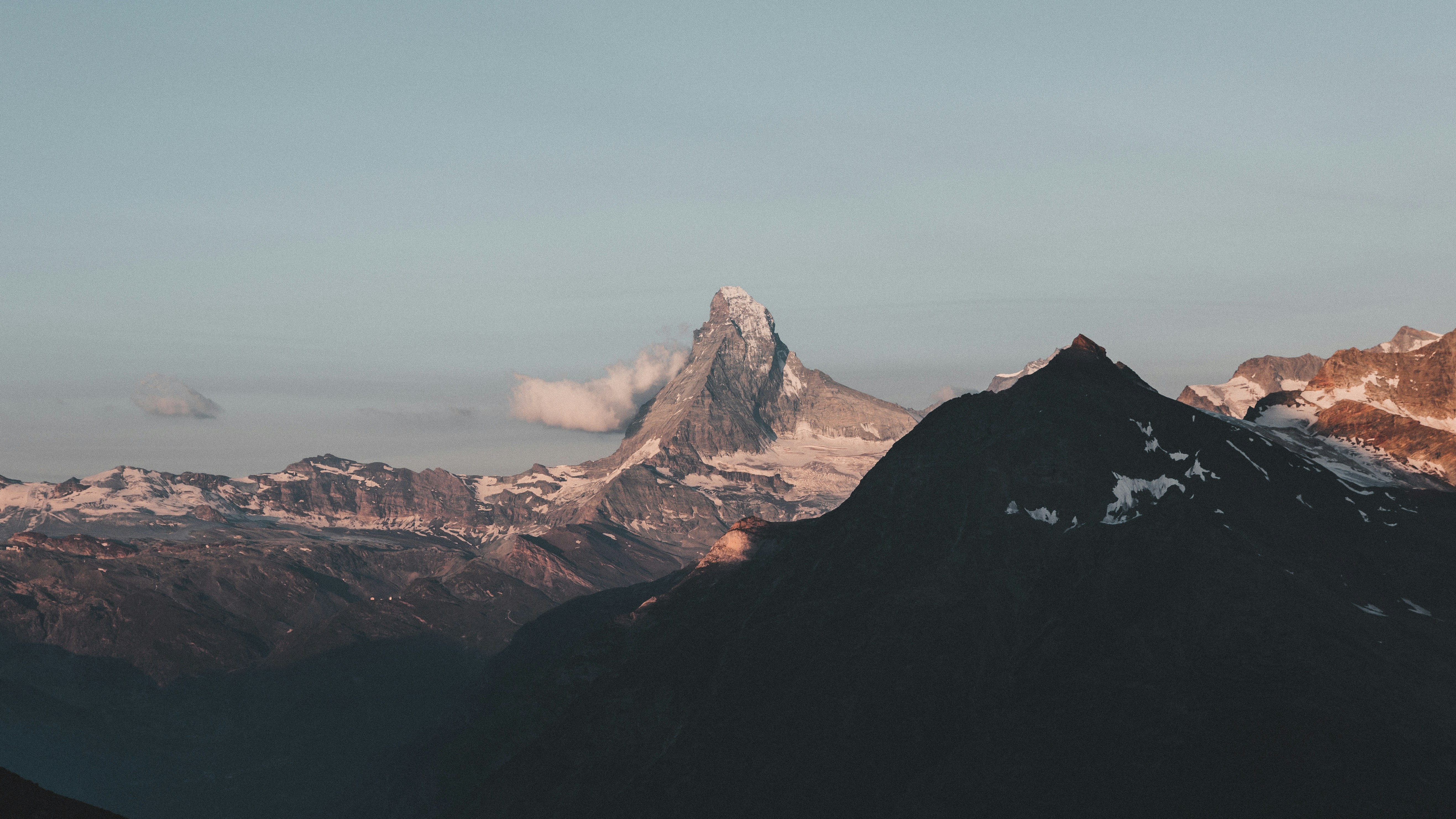 a view of a mountain range at sunset, 