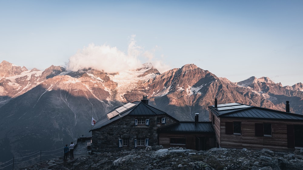 a house on a hill with a mountain in the background