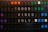 A vintage-style flip board displaying the message 'GOOD VIBES ONLY'. The board features several rows of rectangular panels with a mix of colors, including orange, purple, green, and blue alongside black. Each letter is white against the black background, creating a contrasting visual effect.