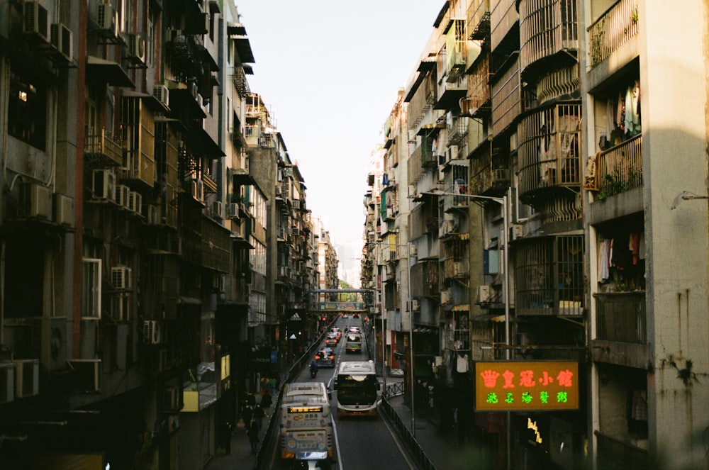 a city street filled with lots of tall buildings