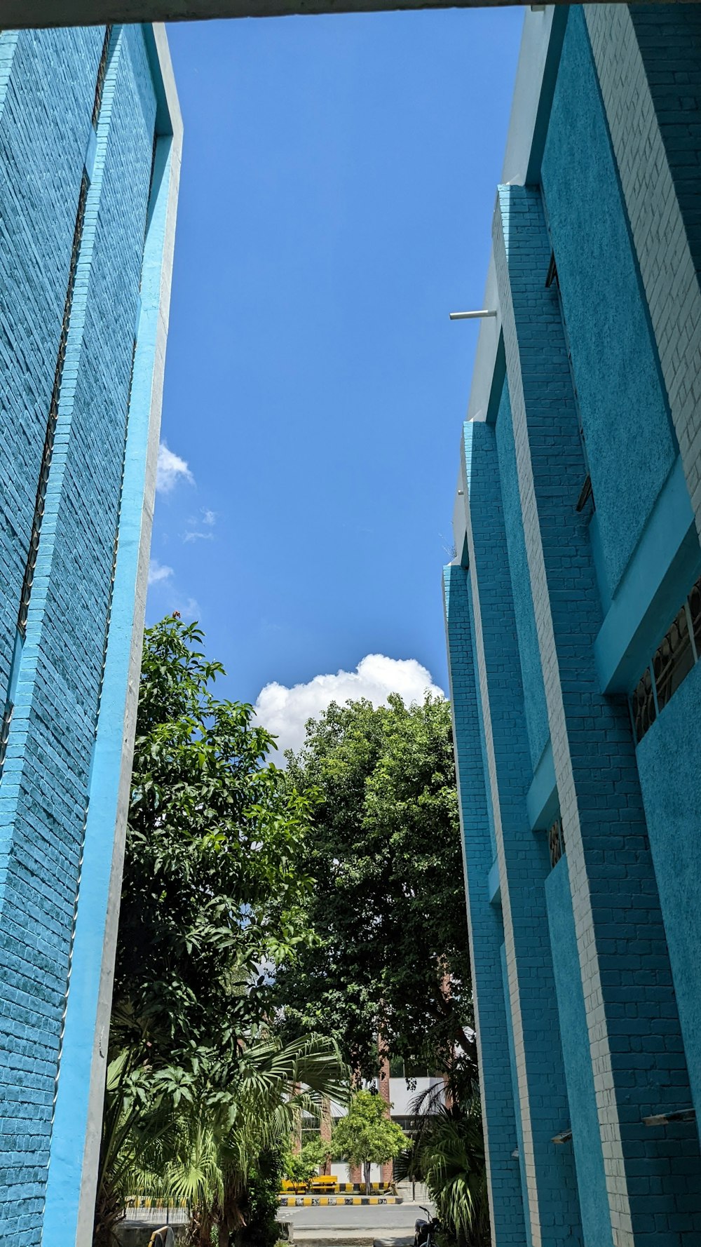 a blue building with a blue sky in the background