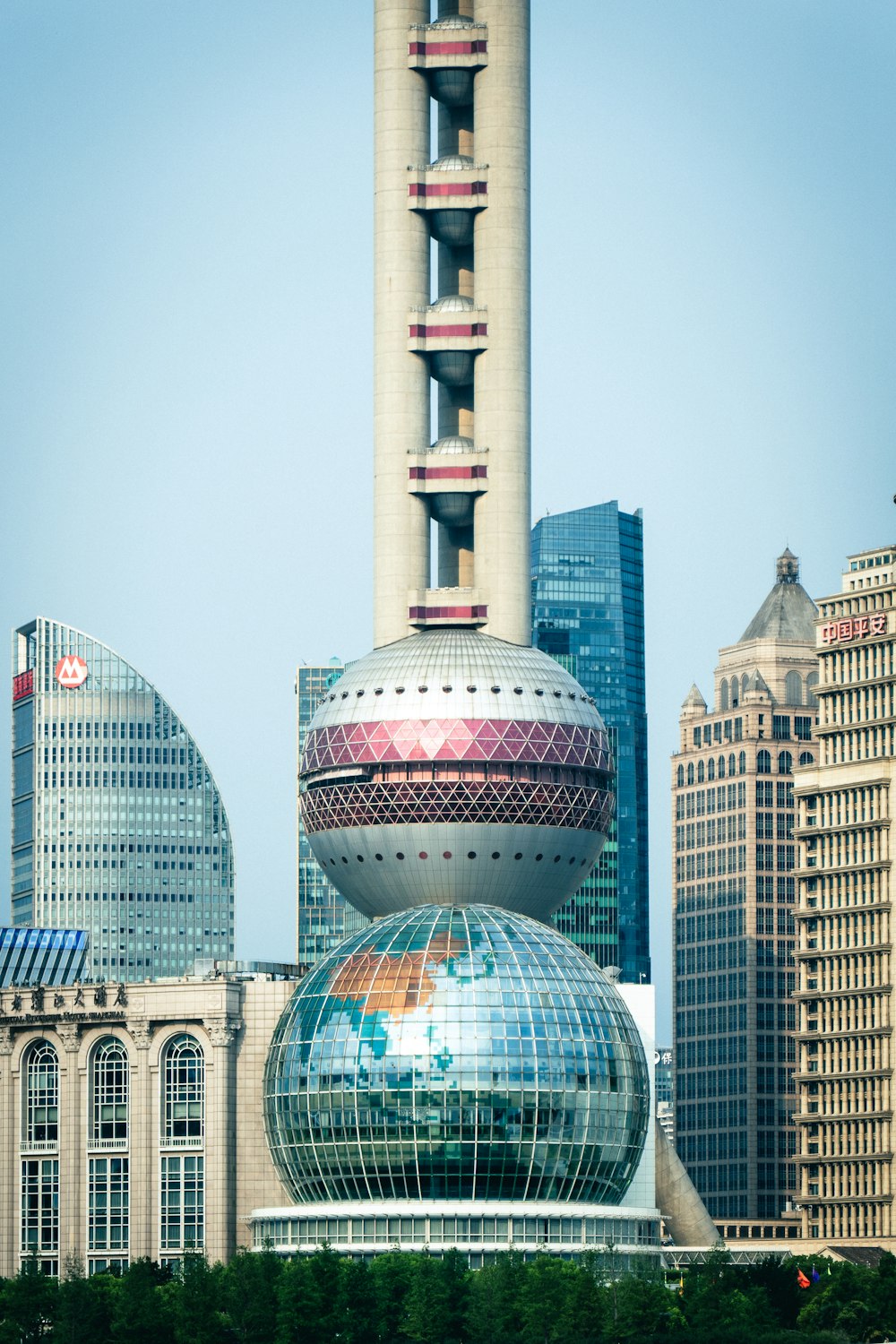 a tall building with a glass dome on top of it