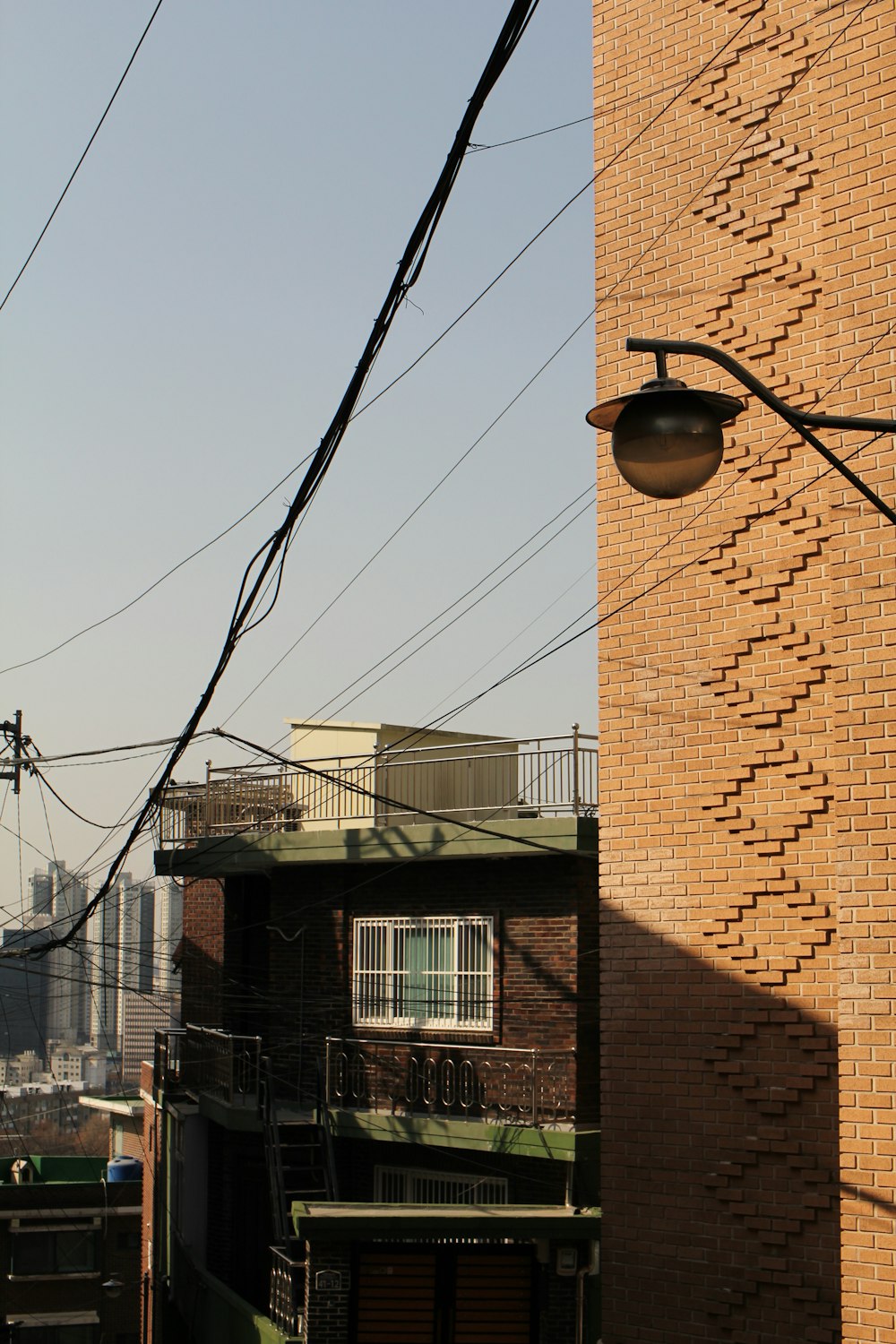 a brick building with lots of power lines in front of it