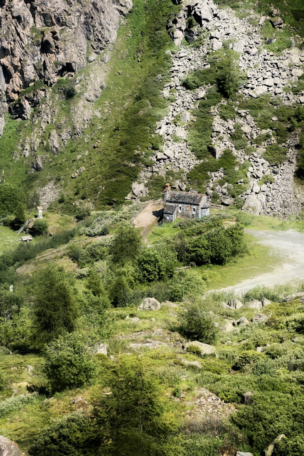 a mountain with a house on the side of it