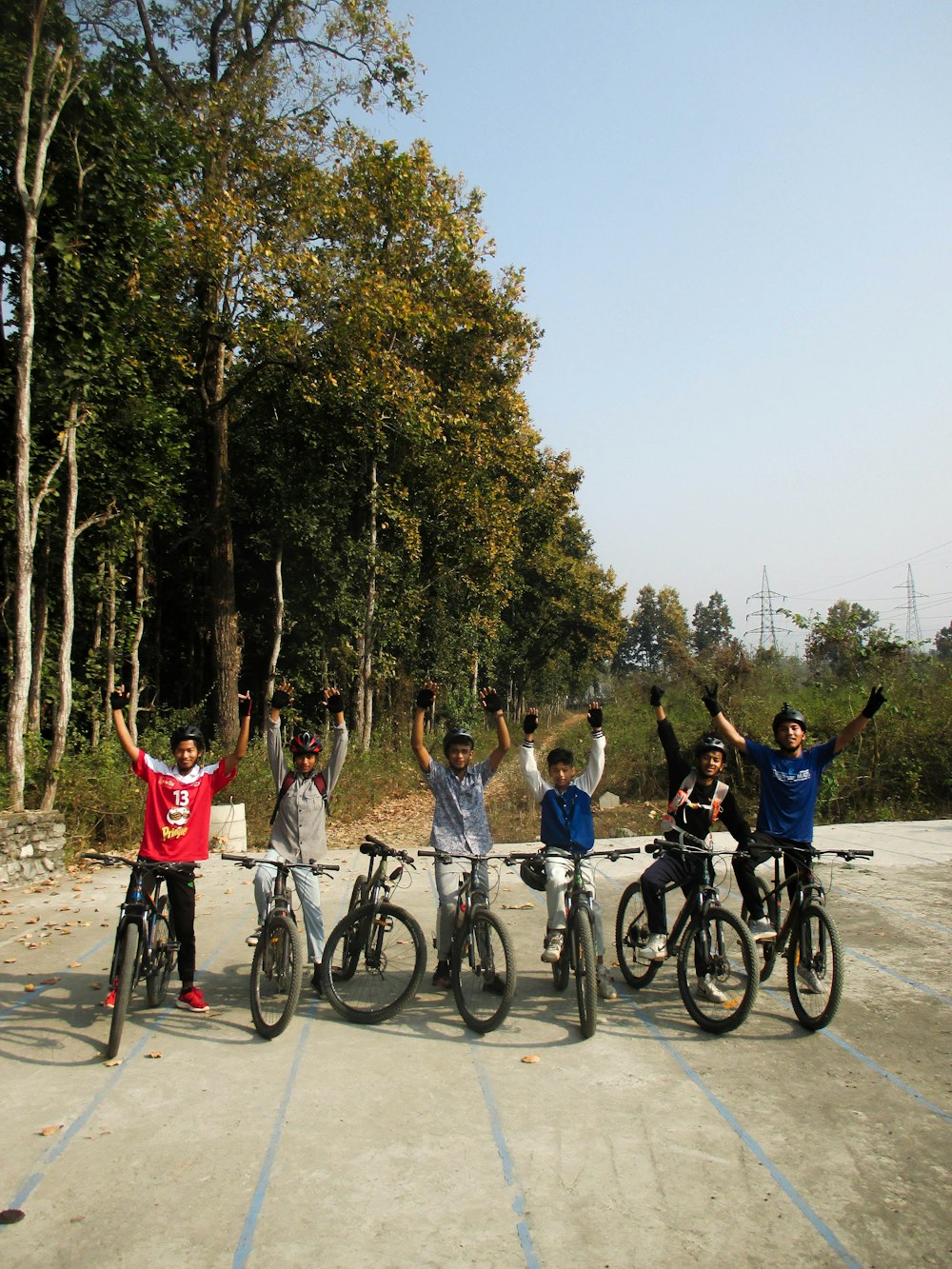 a group of people riding bikes next to each other