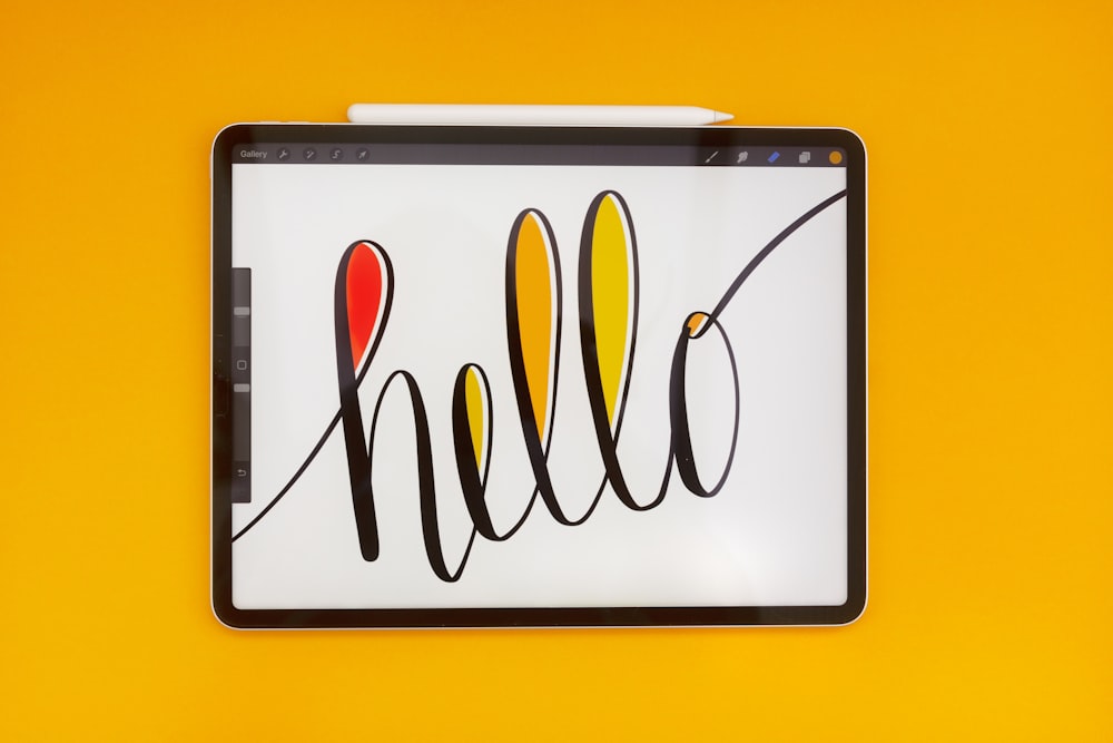 a tablet with the word hello written on it
