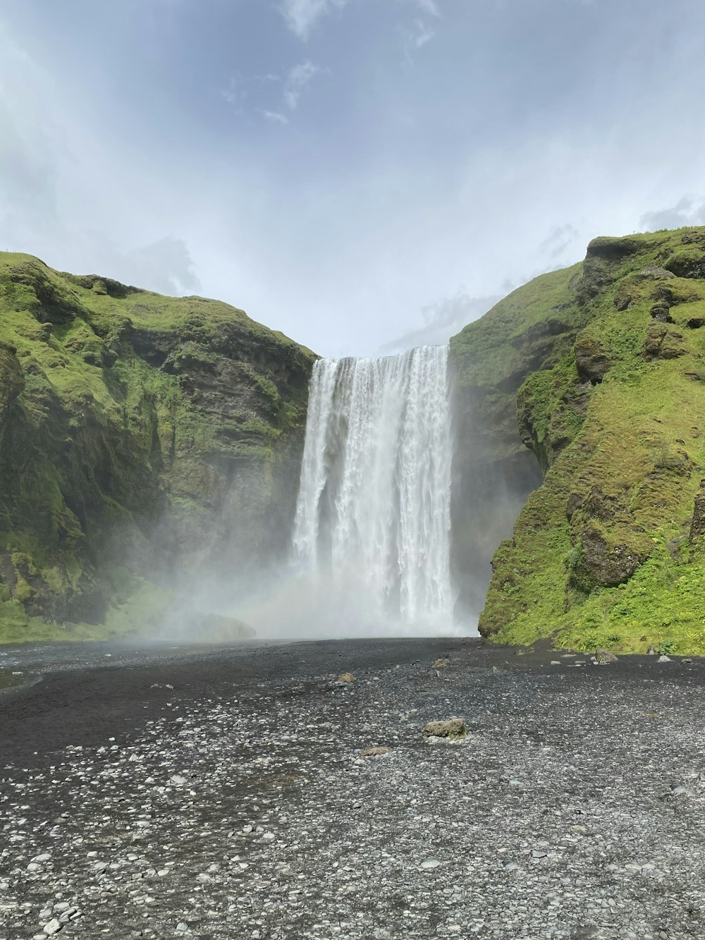 a large waterfall is in the middle of a river