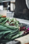 a close up of a bunch of vegetables on a cutting board