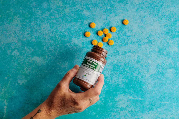 Supplement capsules and bottle