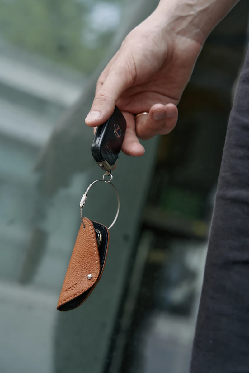 Hand holding a car key fob