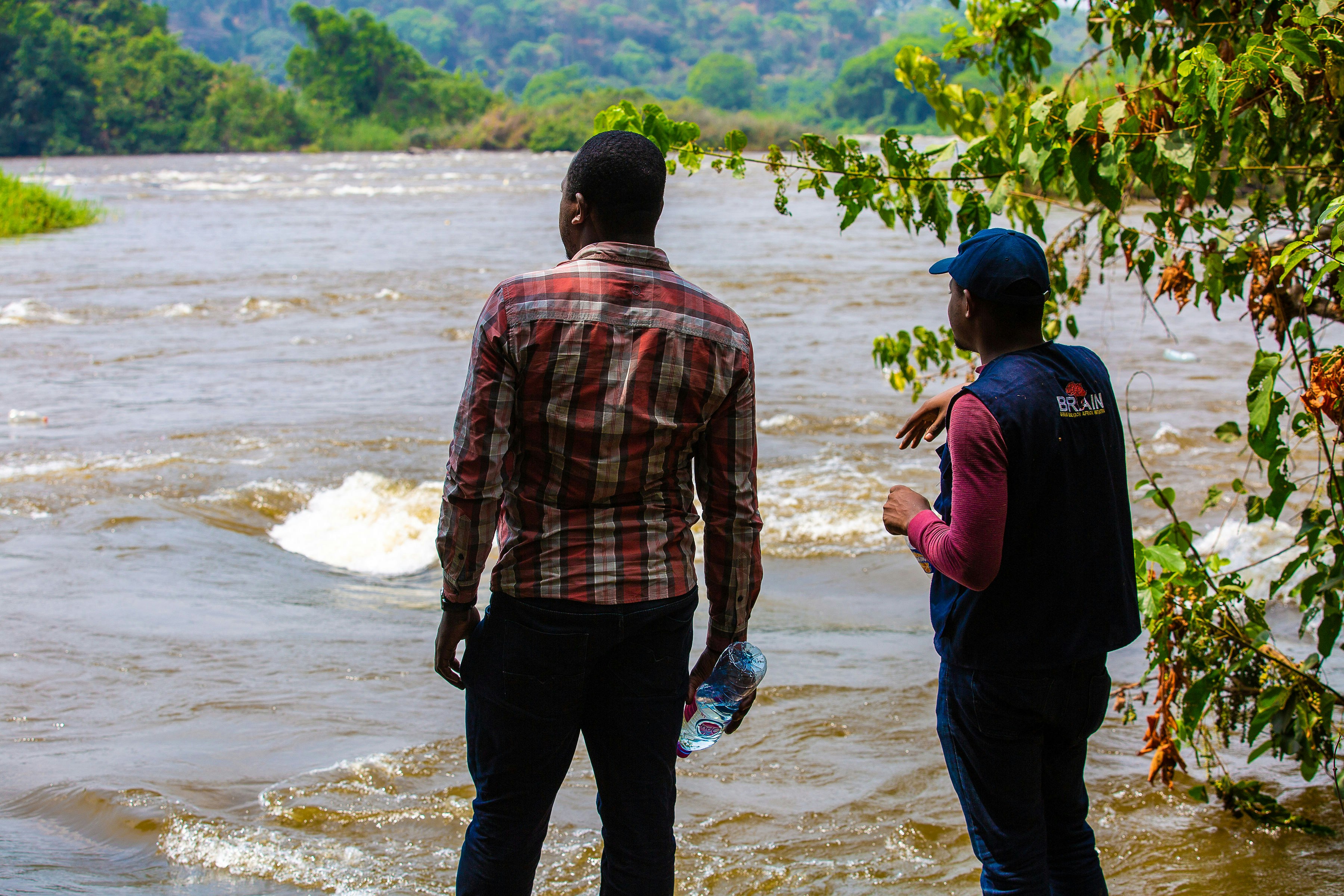 a man and a woman are standing in the water