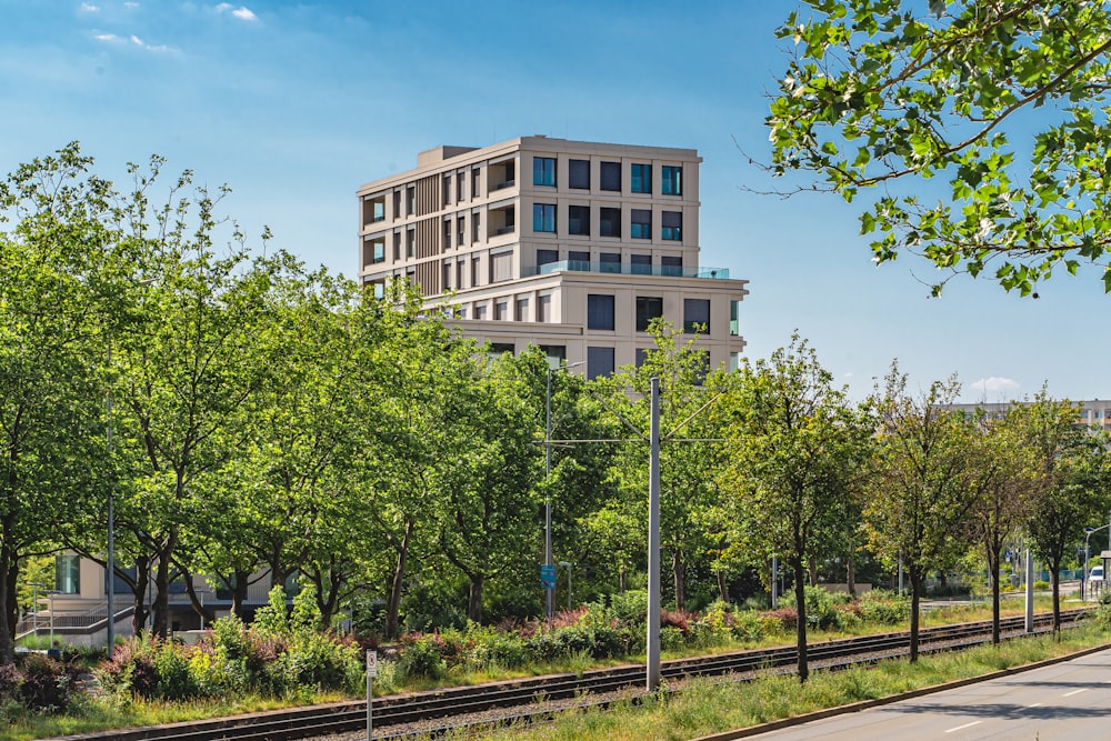 a train track with a building in the background