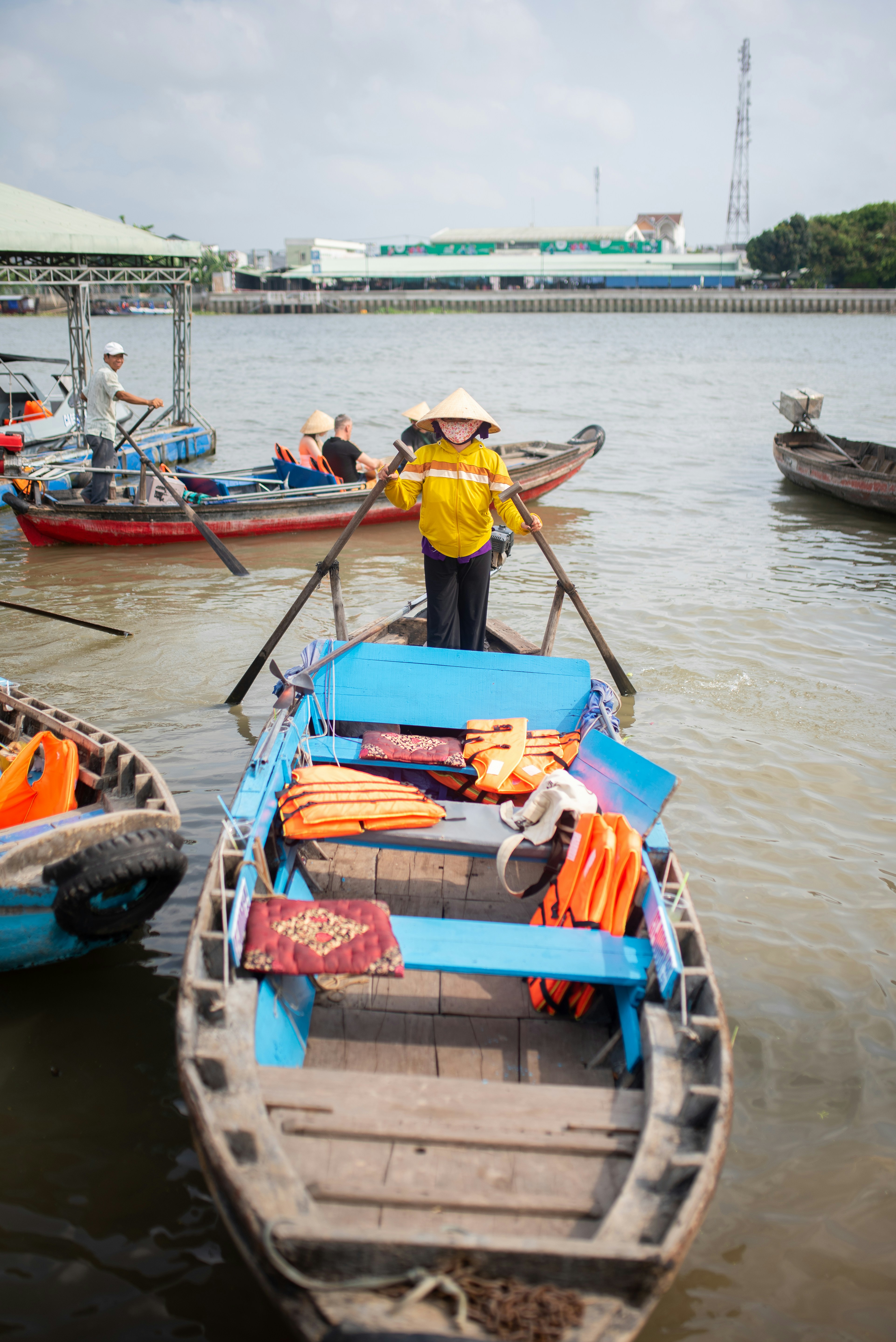a man standing on a boat in the water