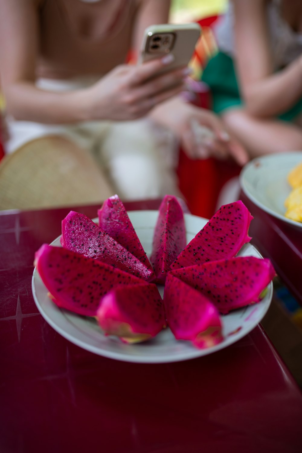 a plate of food on a table with a cell phone