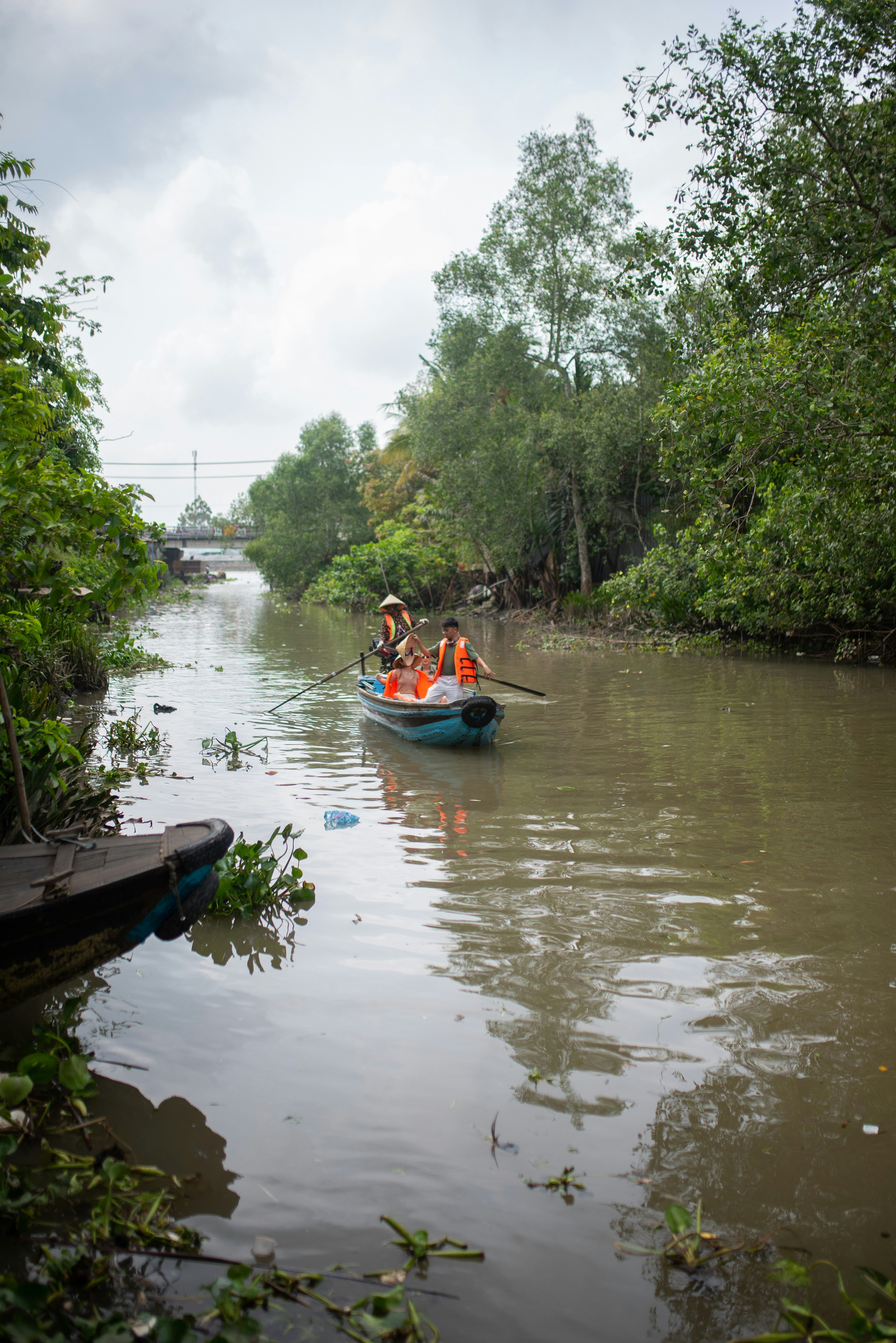 a couple of people in a small boat on a river