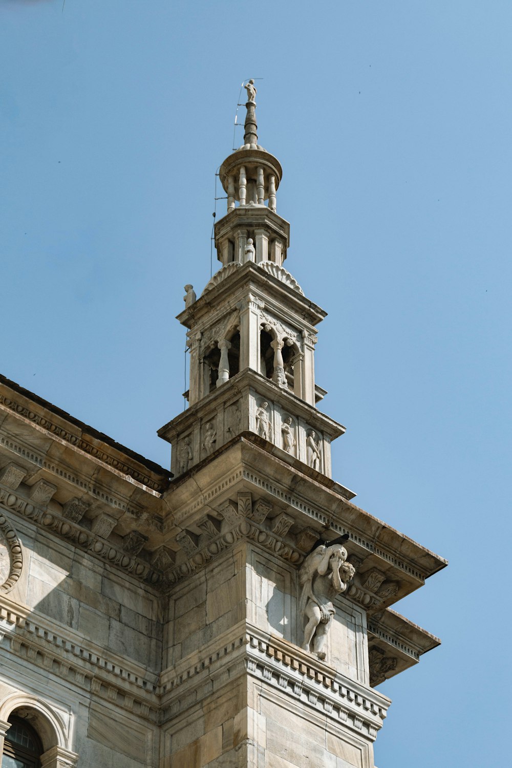 a tall tower with a clock on the top of it