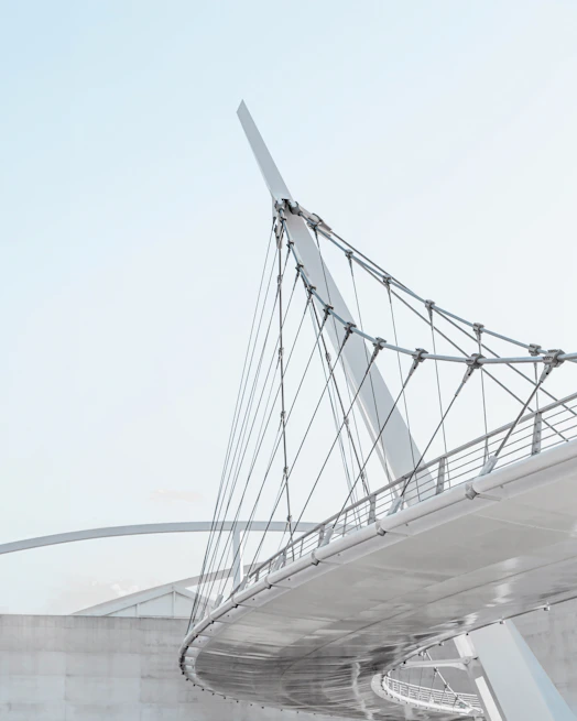 A sleek, modern bridge under construction showcasing AI-driven design elements and structural analysis.