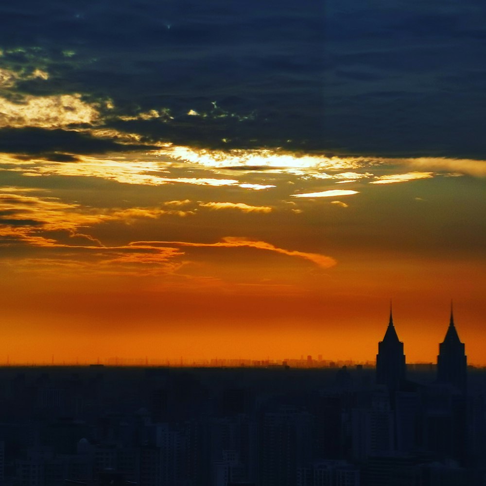 a view of a city skyline at sunset