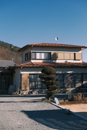 a house with a mountain in the background
