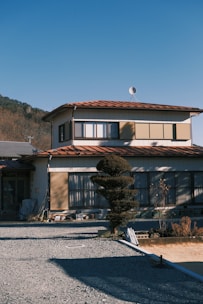 a house with a mountain in the background