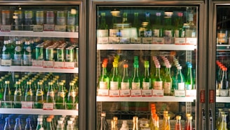 a refrigerator filled with lots of bottles of alcohol