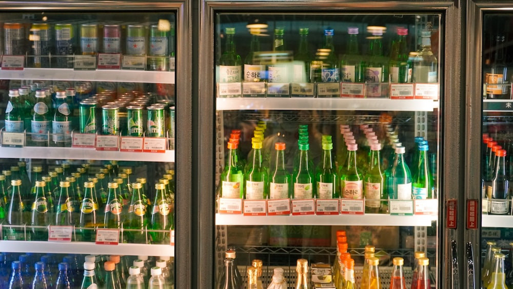 a refrigerator filled with lots of bottles of alcohol