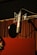 a microphone with a red curtain behind it