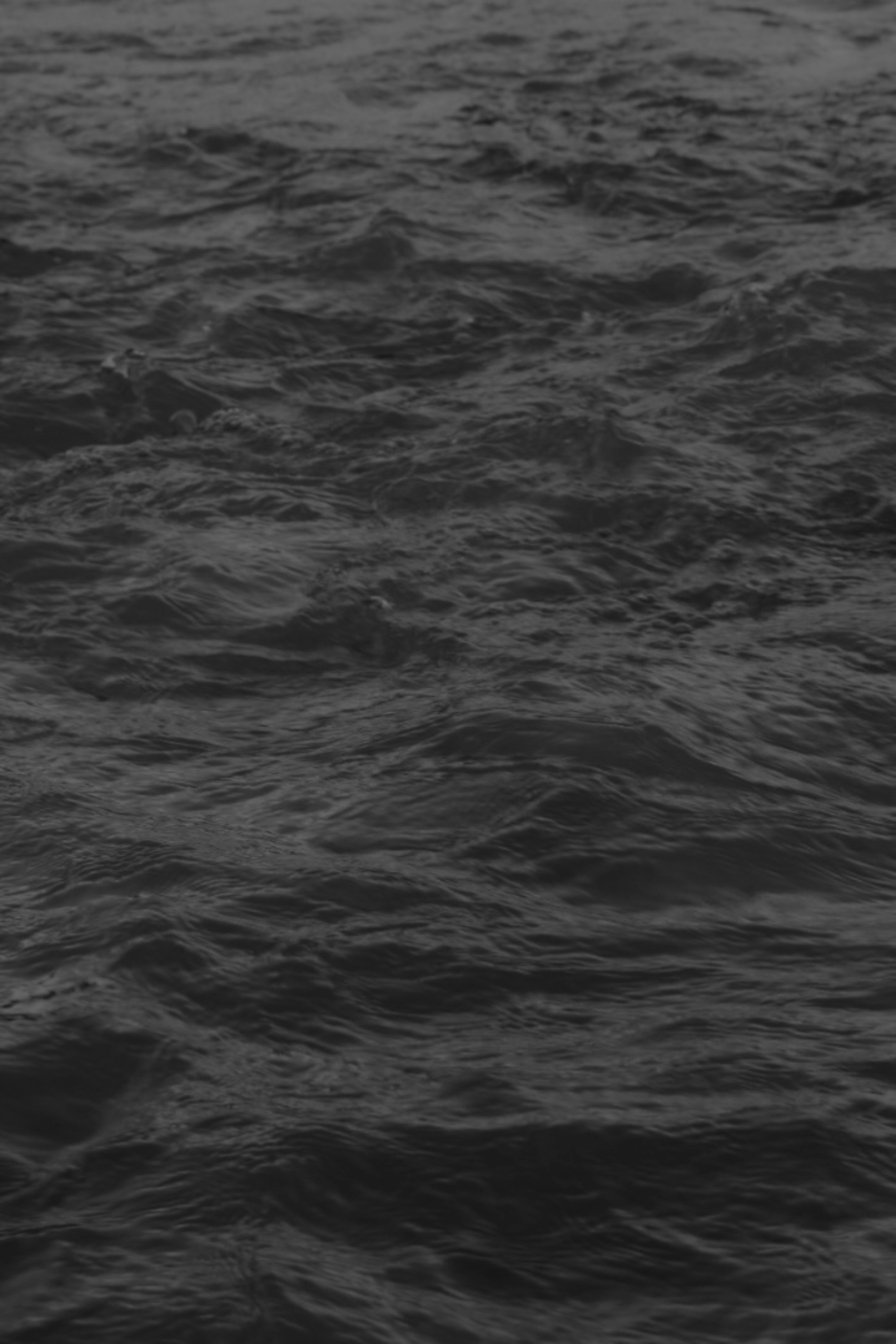 a black and white photo of a body of water