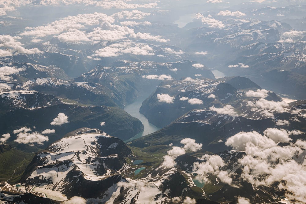 an aerial view of a mountain range with a river running through it