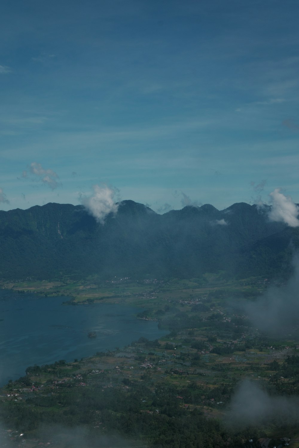 a view of a body of water with mountains in the background