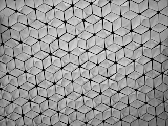 Minimalist pattern of interlocking hexagons symbolizing molecular structures in slate hues.