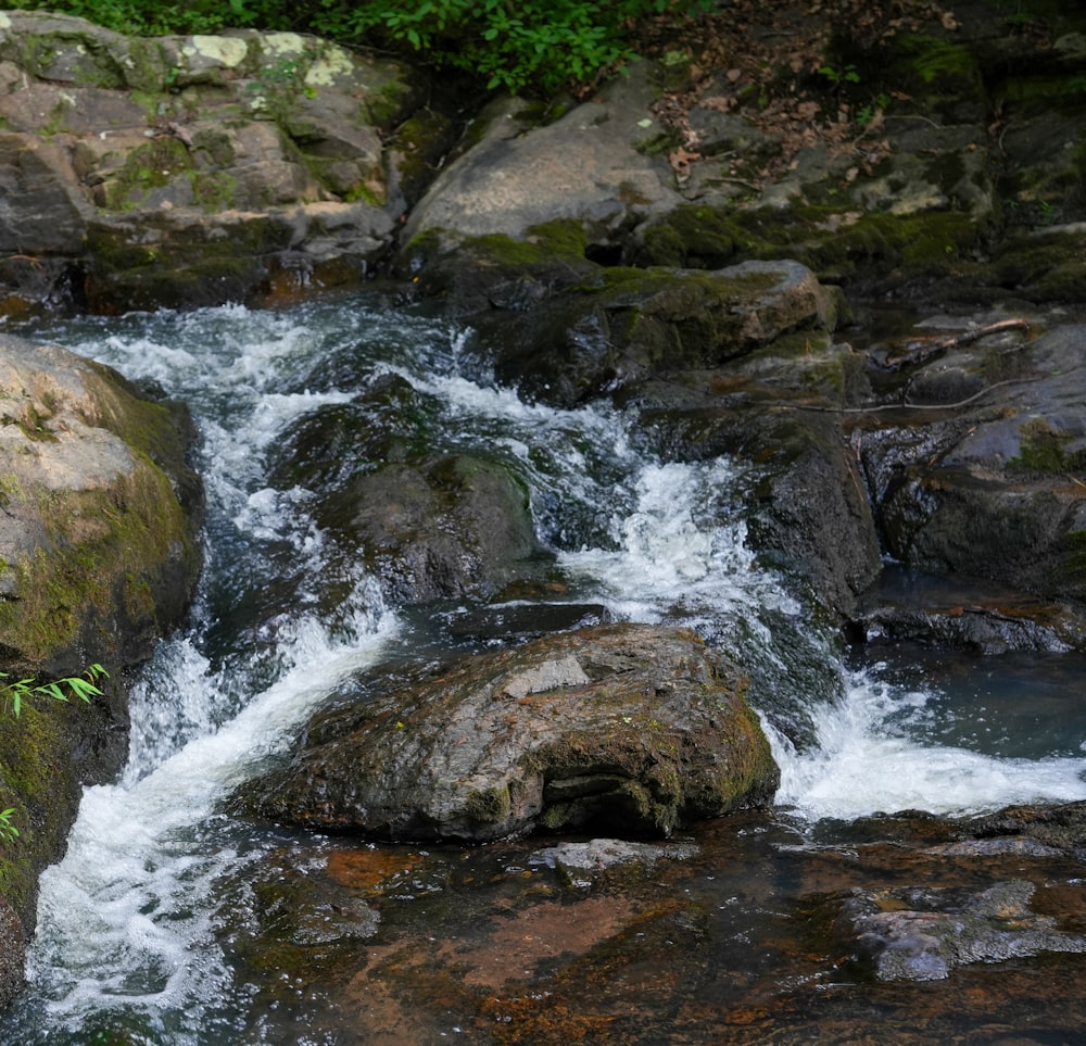 a stream of water running between two large rocks