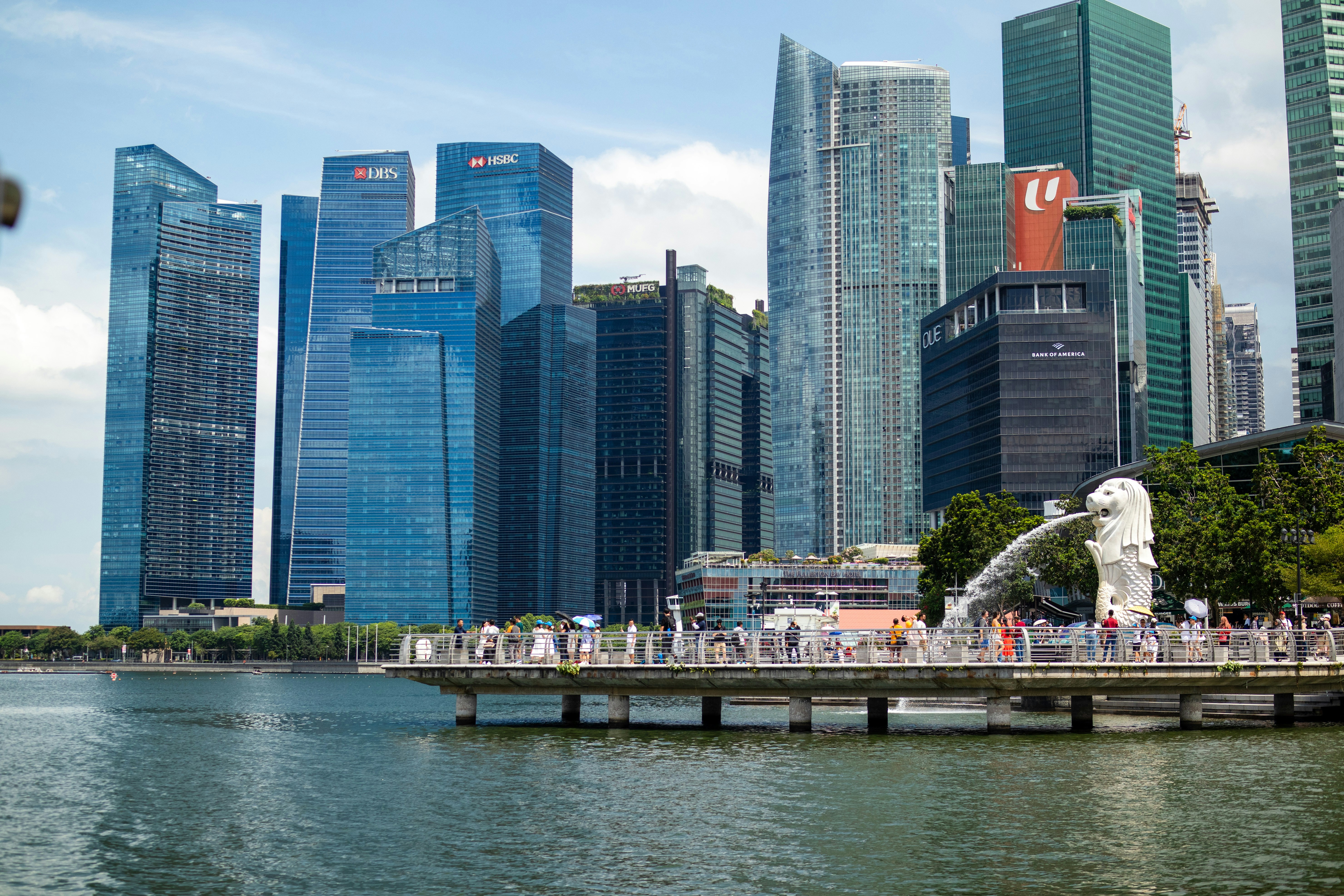 a body of water in front of a city skyline