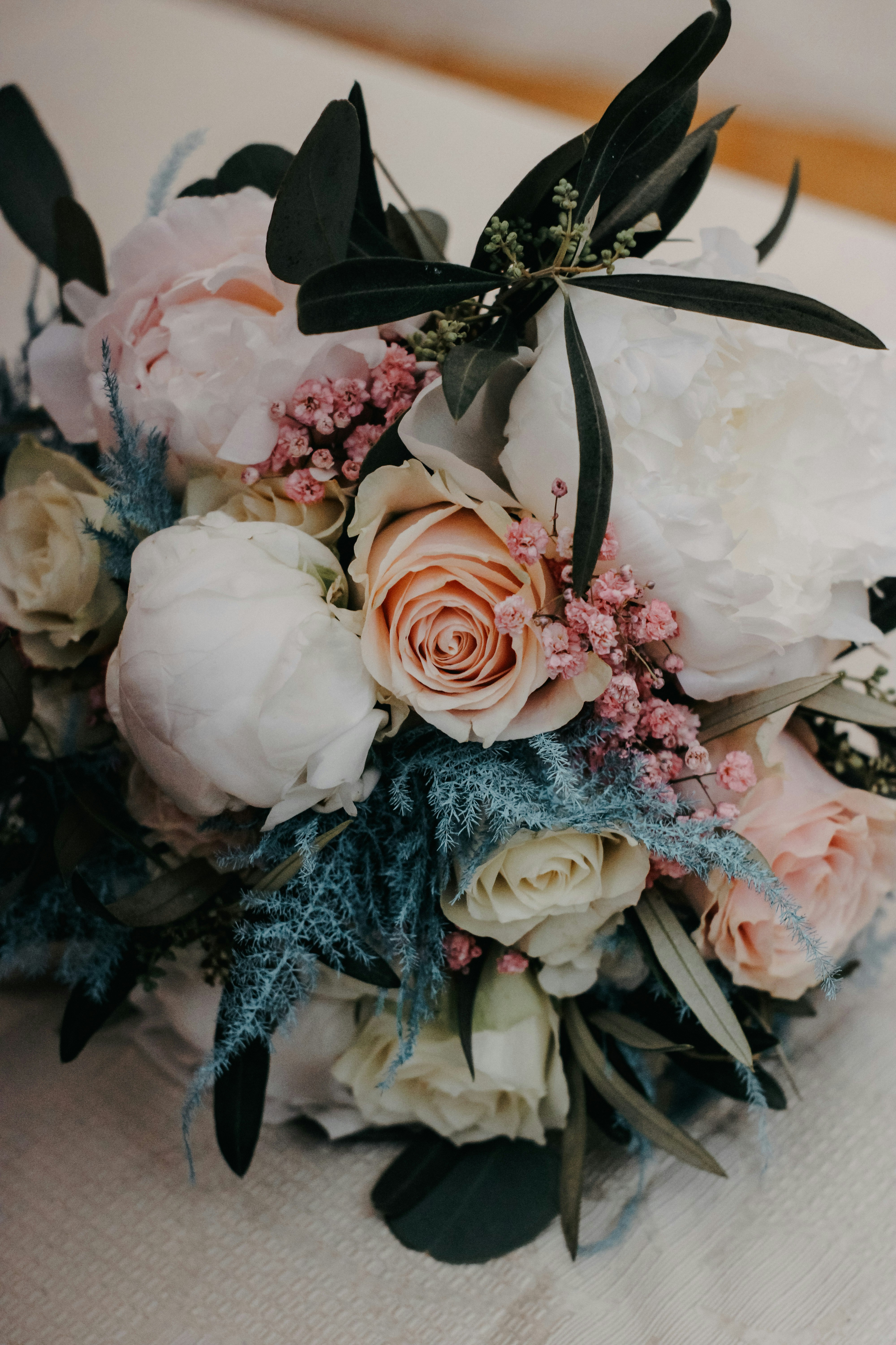 a bouquet of white and pink flowers on a table