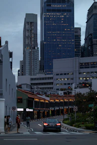 A vibrant street scene in Singapore showcasing modern architecture and bustling life.