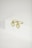 Two gold hoop earrings with heart-shaped pendants featuring small, sparkling stones are displayed on a white surface. The simple background highlights the elegance and shine of the jewelry.
