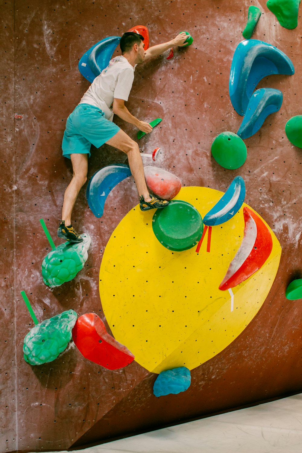 a man climbing on a climbing wall