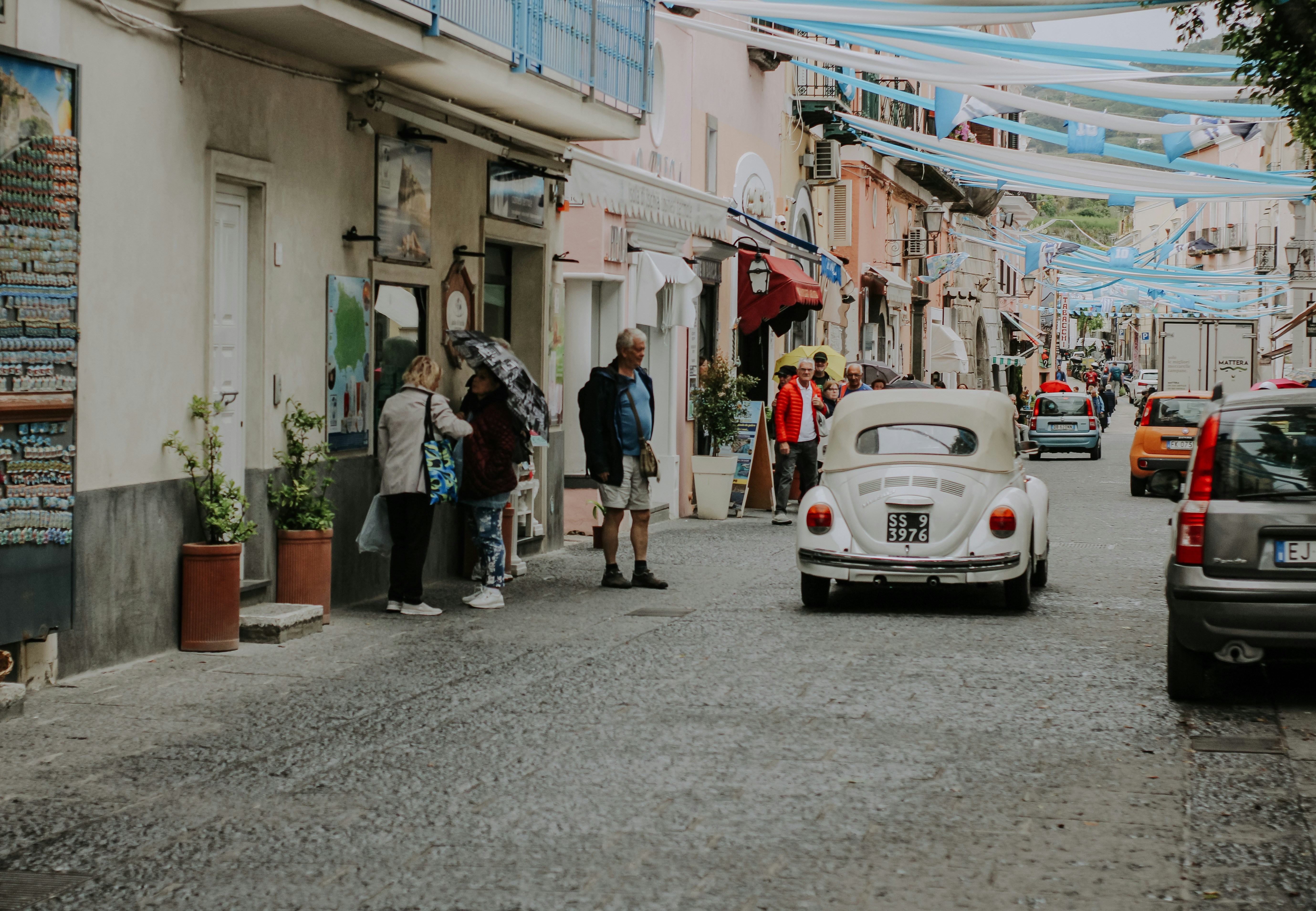 a white car parked on the side of a road